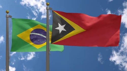 Flagge Brasiliens gegen Flagge Osttimors am Fahnenmast