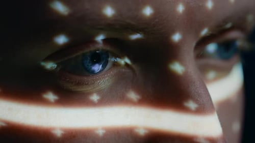 Biometric Facial Recognition Scanning of Blue Eye's Iris. Futuristic Concept: Projector Identifies