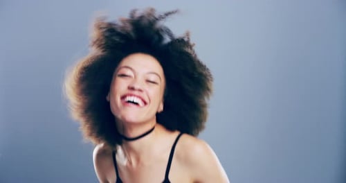 Woman Dancing and Shaking Her Head in Studio