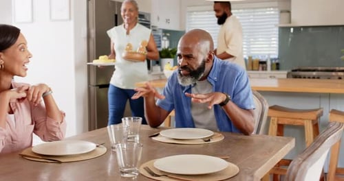 Family Gathering Around Dining Table at Home