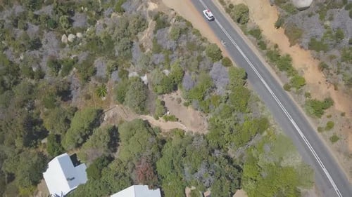 Aerial following car along costal highway in South Africa