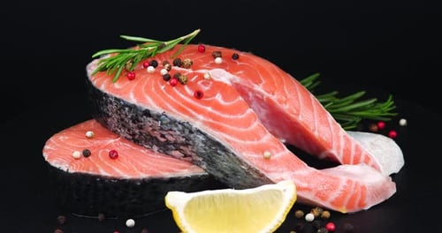 Trout Steaks Rotation Video. Raw Slices with Perfect Texture of Uncooked Red Fish. Sea Food