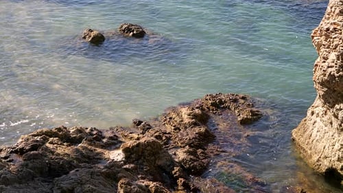 Looking down at beautiful rocky beach with turquoise water