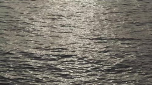 Peaceful atmosphere in the ocean, calm water, sun bright, sunrise, static shot