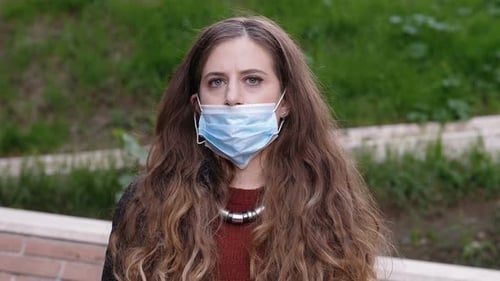 Woman Wearing Face Mask in Urban Setting