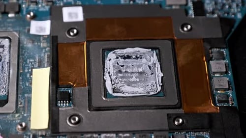 Macro ZoomIn on a CPU with Thermal Compound on a Circuit Board