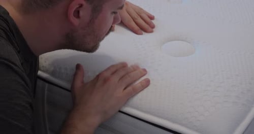 Inspecting Mattress Quality Close-Up