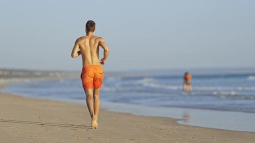 Lifeguard Running on the Beach