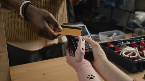 Customer Paying with Card at Boutique Shop