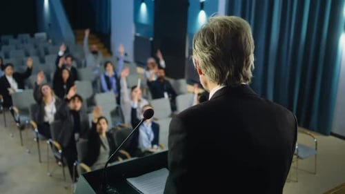 Back View of Organization Representative Giving Interview to Journalists