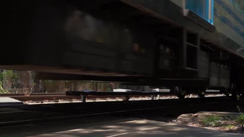 Train on the Railroad in Motion Iron Wheels and Train Rails Close Up Transportation of People
