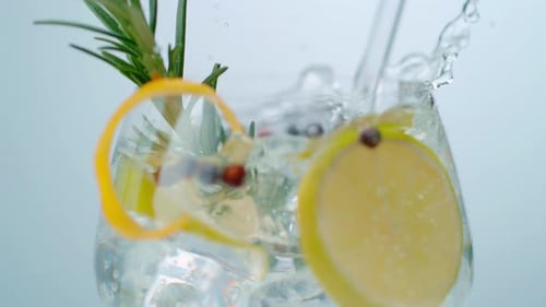 Refreshing Beverage with Lemon, Ice, and Rosemary