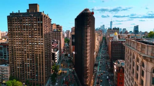 Rising over two lively streets crossing at the Flatiron Building in New York, USA.