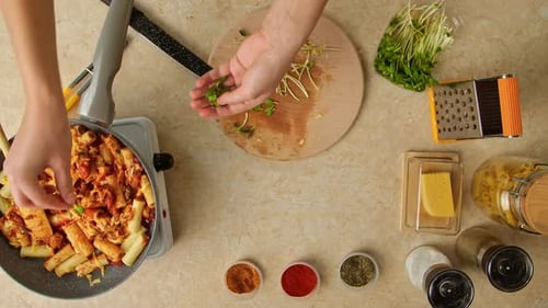 Preparing Healthy Pasta Dish with Greens and Spices