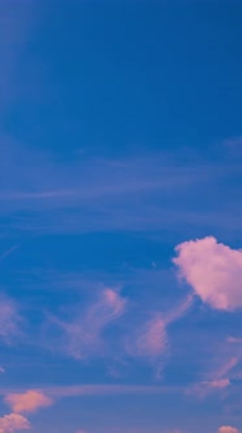 Clouds Moving Across a Bright Blue Sky