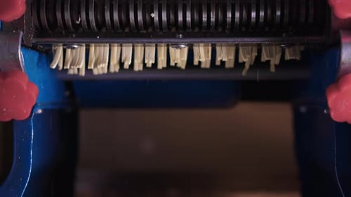 Close Up of Pasta Pouring from Machine