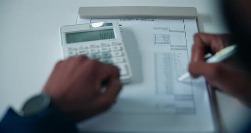 Hands, accounting and calculator in office with writing, paperwork and income statement at company
