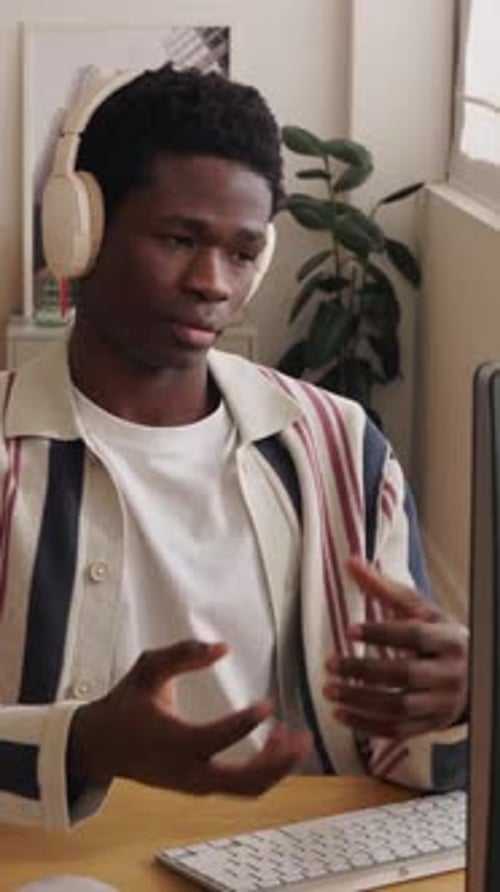 Young Black Man Working From Home Having a Video Call