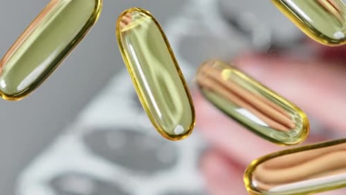 Vitamine E, fish oil capsules spill out of a blister pack