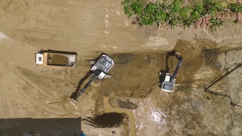 Aerial View Construction Kickoff Pouring First Concrete and Equipment in Action