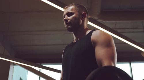 Athletic Handsome Male Sportsman Working in the Gym Using Barbell Strong and Healthy Bodybuilder