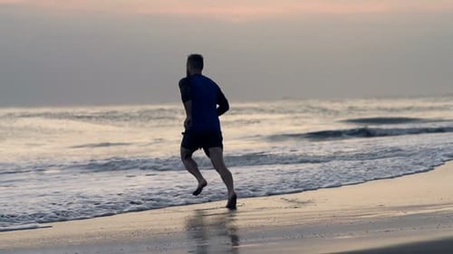 Man Running into Sea Slow Motion