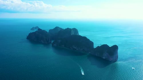 Aerial view of iconic tropical turquoise water Pileh Lagoon surrounded by limestone cliffs, Phi Phi