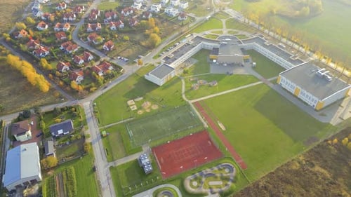 Recreational green grass active sports hockey and football fields overhead top down view. Competitio