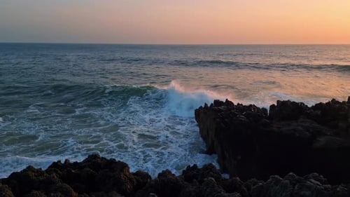 Dramatic Ocean Breaking Rocks Morning Hill Closeup. White Spray Crashing Huge Stones