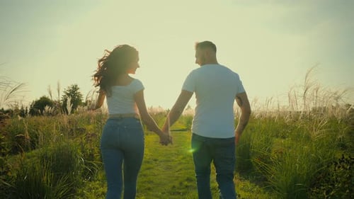 Back View Adorable Sweet Young Caucasian Couple Man Guy Male Holding Hands Woman Girl Female