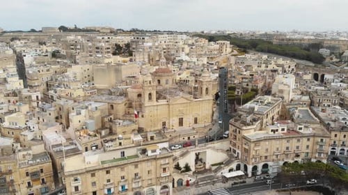 Slow pan aerial 4k drone footage of the cityscape of the densely populated Mediterranean island, Mal
