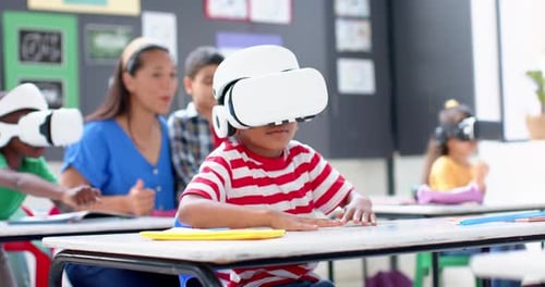 In school, children using VR headsets for interactive learning in classroom