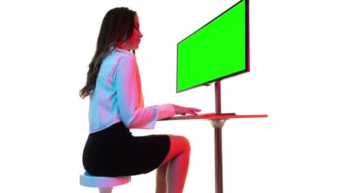 Female on a Computer with Green Screen