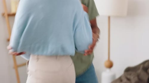 Young Couple Dancing in Home Together