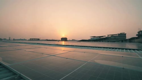 Solar Panels on Rooftop at Sunset