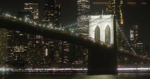 Brooklyn bridge at night, skyline of New York, NYC citylights, angled view