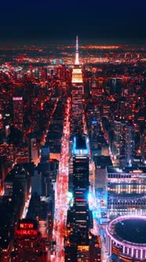 Glowing scenery of amazing New York at night. Flying high above the luminous panorama