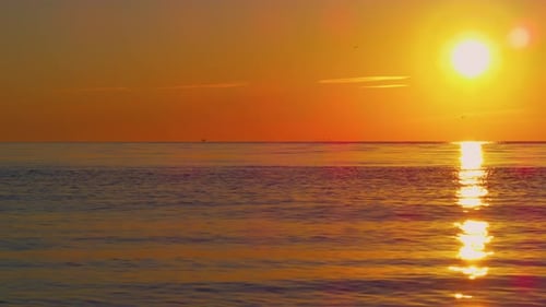 Panoramic Seascape View at Sunset Evening. Orange Sun Light Path Reflection At