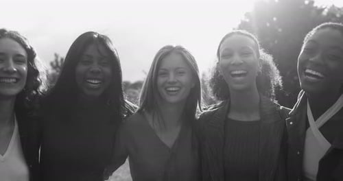 Group of Women Laughing and Smiling Together Outdoors