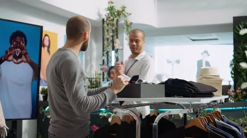 Man Shopping for Necktie at Clothing Store
