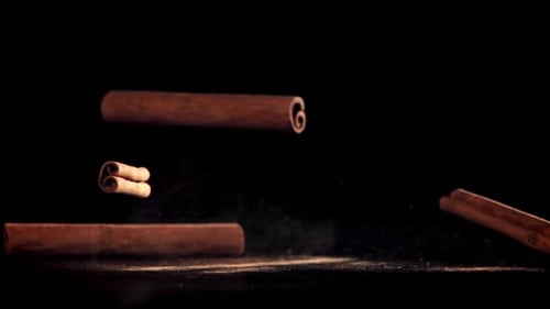 Cinnamon Sticks Fall on the Table Filmed on a Highspeed Camera at 1000 Fps
