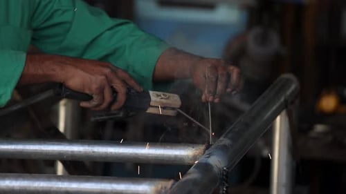 Welding Process at the Steel Factory Closeup on Hands