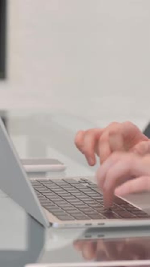 Side View of Female Hands Typing on Laptop, vertical video