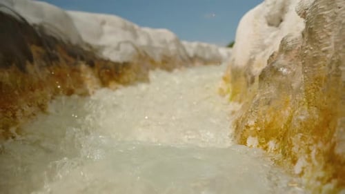 White Stone Gutter through which Water Flows from a Spring, with Calcite Stalactites. Pamukkale.