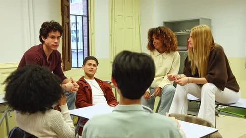 Group of High School Students Working Together in Classroom