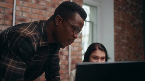 Cheerful Office Workers Chatting in Working Room Black Man and Caucasian Woman Teamwork