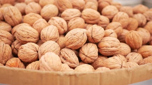 A Scoop of Walnuts a Superfood Rests on a Stack of Nuts Seeds