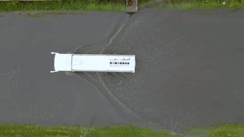 Aerial View of City Traffic with Cars Driving on Flooded Street After Heavy Rain Problems with Road