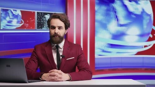 News Anchor Presents News at Desk in Studio