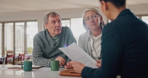 Senior Couple Discusses Financial Planning with Advisor